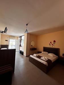 a bedroom with a large bed in a room at House Stamatis in Sarti +55 photos