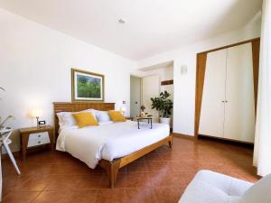 a bedroom with a large white bed with yellow pillows at Best Western Hotel Martello in Lampedusa +62 photos