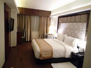 Postel nebo postele na pokoji v ubytování Hotel Oxina Lygon