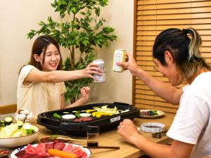 two women standing in front of a table with food at にし阿波ねすと in Higashimiyoshi +31 photos