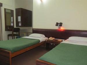 Postel nebo postele na pokoji v ubytování Hotel Stafi