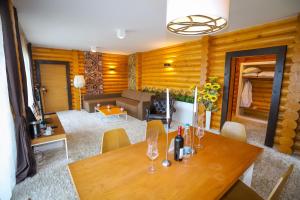 a living room with a table and a couch at Deluxe House Glavatarski Han in Glavatartsi