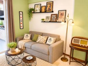 a living room with a couch and a table at Flavia's House in Gaggi