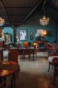 a dining room with a table and chairs at The Bohemian Boutique Guesthouse in Tzaneen