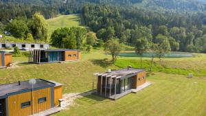 an aerial view of two modular houses on a grass field at Chaletpark Petzen in Feistritz ob Bleiburg