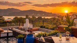a view of the sunset from the balcony of a hotel at The Sierra - By The Lake in Udaipur