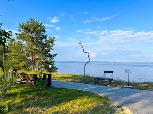a kite hanging from a pole next to a bench at Morewell Resort&SPA in Tolokun
