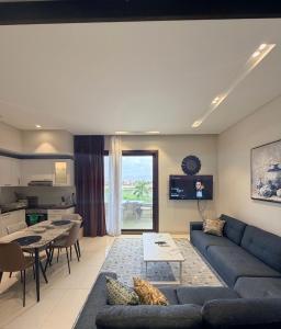 a living room with a couch and a table at Segal 2 Hawana Salalah Forest Island in Salalah