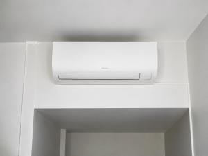 a white vent in a ceiling in a room at Cit' Hotel de France in Rochefort