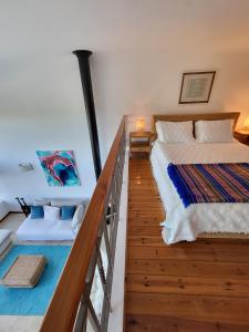 a bedroom with two beds and a balcony at Lighthouse Apartment in Luz