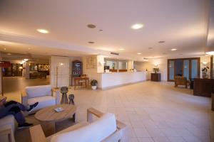 a large living room with couches and a table at Dioscuri Bay Palace in San Leone +162 photos