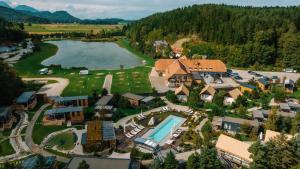 an aerial view of a resort with a lake at Pension Pirkdorfer See in Sankt Michael ob Bleiburg