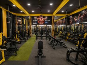a gym with a lot of exercise equipment at Lime Tree Hotel & Banquet Jal Mahal Jaipur in Jaipur