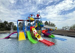 a water park with a water slide in the water at Morewell Resort&SPA in Tolokun +51 photos