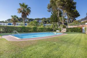 an image of a swimming pool in a yard at Mora Beach in Tarragona