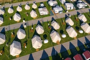 an overhead view of a group of tents in a parking lot at Kampaoh Peniche in Peniche
