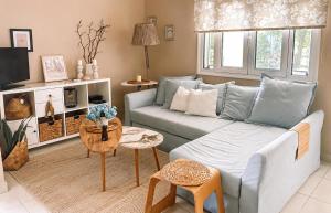 a living room with a couch and a table at Kaloudis Studios & Apartments in Dassia