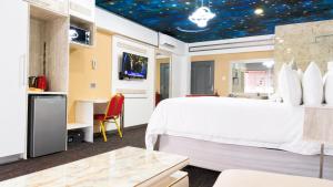 a hotel room with a bed and a starred ceiling at Nkandla Lifestyle in Mthatha