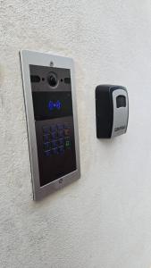 an electronic device is attached to a wall at Casa Alba in Bernalda
