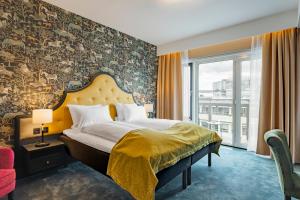 a hotel room with a bed and a large window at Thon Hotel Opera in Oslo +67 photos