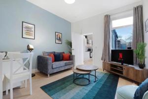a living room with a couch and a table at Sunderland 3BR Retreat Sleeps 6 by Stay With Us in Pallion +38 photos