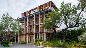 an office building with a wooden facade at Baanna Place in Ban Na