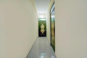 a hallway with a door in a building at Hotel O City View in Dānāpur