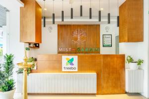 a restaurant with a first carton sign on the counter at Treebo Misty Garden Resort & Spa With Swimming Pool in Munnar
