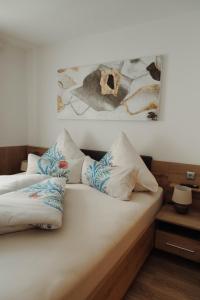 a bedroom with two beds with pillows on it at Ferienwohnung am Waldweg in Kolsass