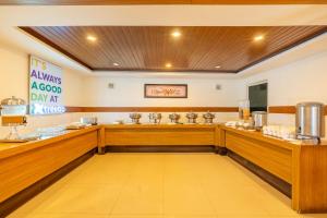 a dining room with a counter in a restaurant at Treebo Misty Garden Resort & Spa With Swimming Pool in Munnar +44 photos