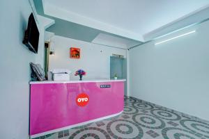 a room with a pink counter with a no sign on it at Hotel O City View in Dānāpur +20 photos