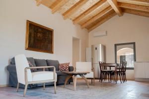 a living room with a couch and a table at Masseria Galeasi in Grottaglie