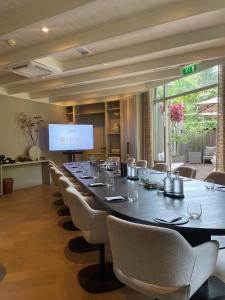 a large conference room with a long table and chairs at Villa de Duinen - Adults Only in Noordwijk aan Zee +30 photos