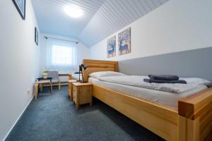 a bedroom with a large bed in a room at Chata Markétka in Dobré +87 photos