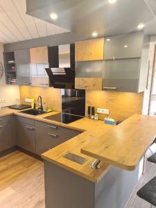a kitchen with a wooden counter top in a room at Ferienwohnung Grahn 15154 in Leer