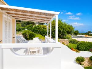 a white deck with a pergola on a house at Maridea - Ondine in Ponza