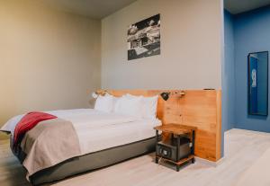 a hotel room with a bed and a table at Revelton Ostrava in Ostrava