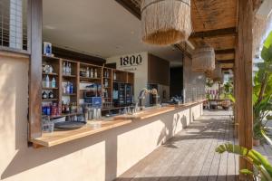 a restaurant with a long counter in a store at First Line Cosy Apartment in Calvià