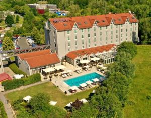 an aerial view of a hotel with a swimming pool at FAIR RESORT All Inclusive Wellness & Spa Hotel Jena in Jena