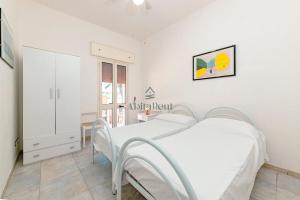 a hospital room with a bed and a window at Baglivi's Flat in Torre Specchia Ruggeri +42 photos