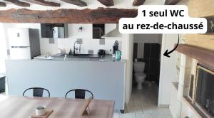 a kitchen with a sink and a counter top at Gîte de l'Aubinière in Brissac-Quincé