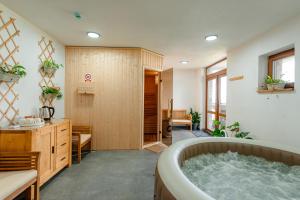 a large bathroom with a tub in the middle at ROGOChalet in Rogojel +57 photos