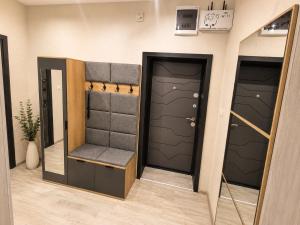 a room with two sets of garage doors at Apartment Be Happy 3, Premium Apartment in Ruse City Centre in Ruse