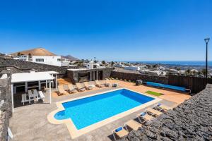 a swimming pool on the roof of a house at Villa Oasis de Asomada in La Asomada