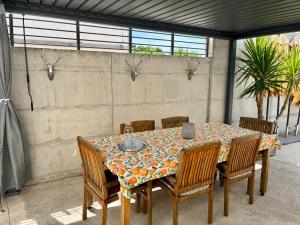 a table with chairs and a tablecloth on it at St.Barth Apartments in Šibenik