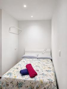 a bedroom with a bed with a red towel on it at STUDIO FOR 3 PERSON & ANOTHER FOR 4 PERSON - MIRAMAR MARTIL ll in Martil