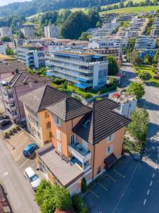 an overhead view of a city with buildings at Mount Pilatus Rooms Lucerne in Lucerne