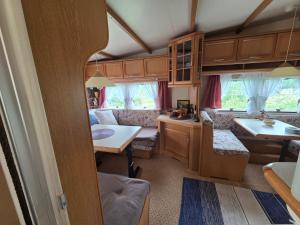 a kitchen and dining area of an rv at Visit Senja Lady in Senja