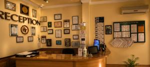 an office with a desk and a wall of pictures at Old Town in Izmail