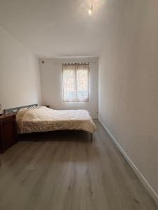 a small bedroom with a bed and a window at Casa Lia in Ortiporio